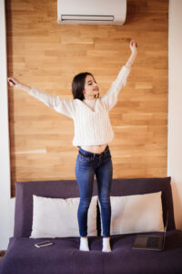 tired attractive woman work at home stretching arms to relax after hard day